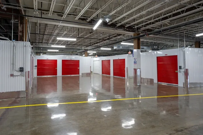 Spacious indoor storage facility with drive-up access lanes and multiple unit entrances